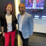 Christina Aldan and Reggie Burton of Avery Burton Foundation Standing in the Raiders HQ