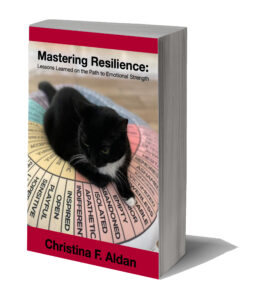 Book cover of Mastering Resilience, written by Christina Aldan, with a black cat lying on a giant pillow with an emotions wheel printed on it
